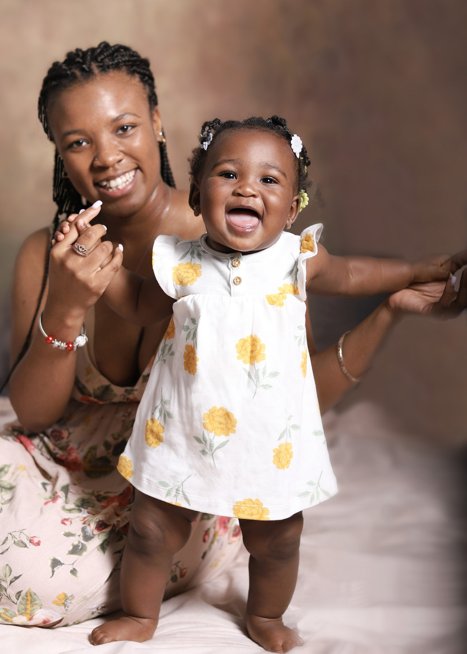 Young mom and toddler daughter portrait happy and smiling